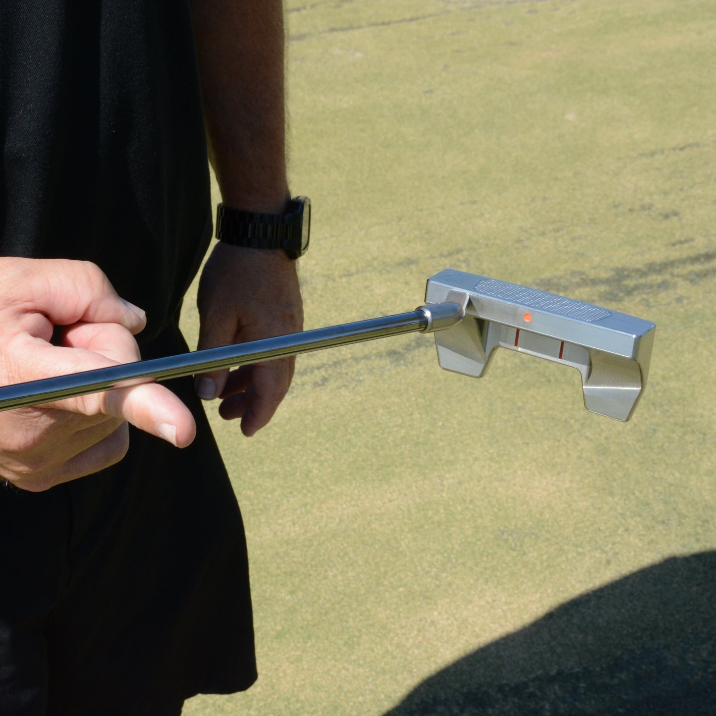 Danger Golf Rhyno Putter balancing in a face balanced position.